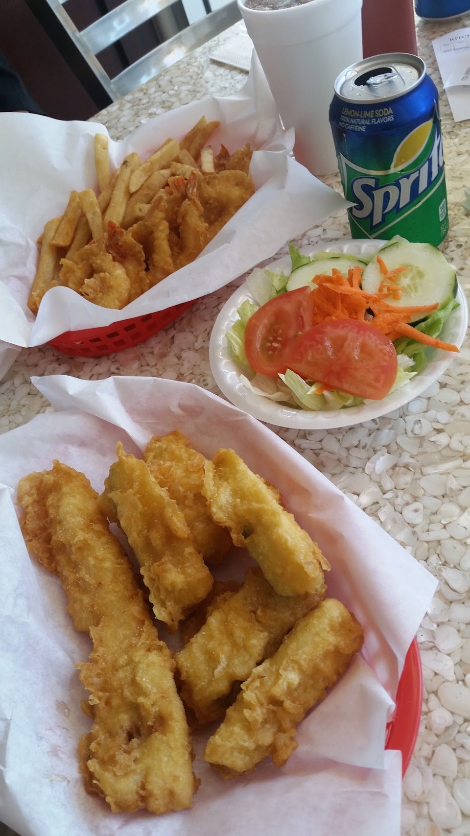 Takeaway menu showing fries, chips, and soda.