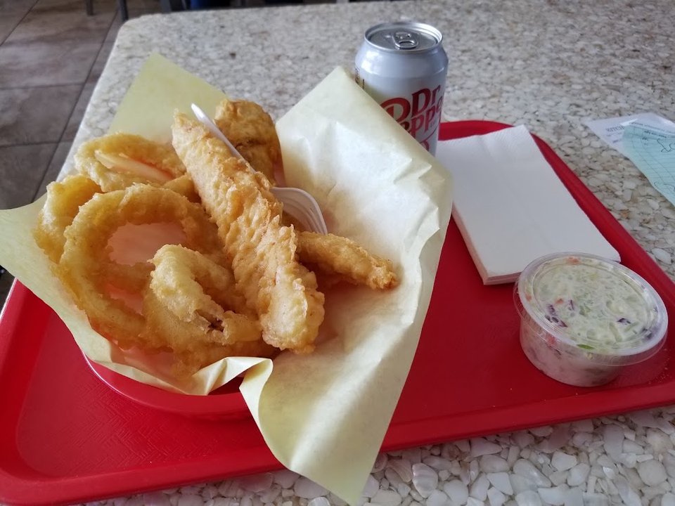 Printed menu with fried fish and side orders.
